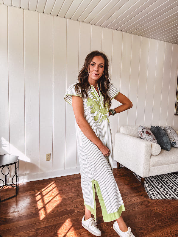 Sage and white striped midi length dress with short sleeves, mock collar, V neck and sage floral embroidery at the yoke and sage trim with side slits.