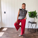 Linen and cotton blend flowy wide leg pants with elastic waist, pockets and frayed hem and pockets.
