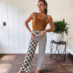 Camel colored ribbed textured bodysuit with snap closure and silver western buckle adjustable shoulder straps with square neckline.