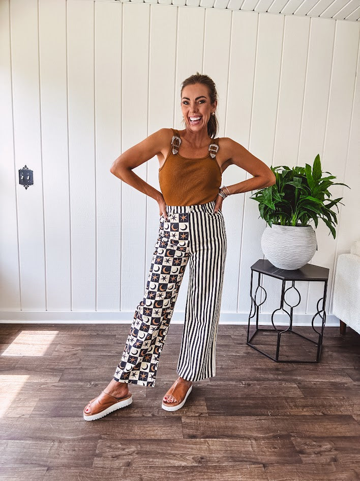Camel colored ribbed textured bodysuit with snap closure and silver western buckle adjustable shoulder straps with square neckline.