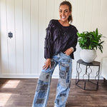 Medium wash denim wide leg pants with washed black, black and white stripe and denim patchwork detail throughout.