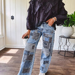 Black long sleeved blouse with lace and eyelet ruffle detail throughout.