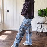 Medium wash denim wide leg pants with washed black, black and white stripe and denim patchwork detail throughout.