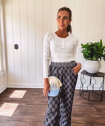 Textured washed black checkered elastic waist fray hem pants with pockets.