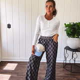Textured washed black checkered elastic waist fray hem pants with pockets.