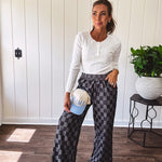 Textured washed black checkered elastic waist fray hem pants with pockets.