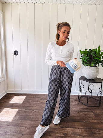 Textured washed black checkered elastic waist fray hem pants with pockets.