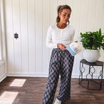 Textured washed black checkered elastic waist fray hem pants with pockets.