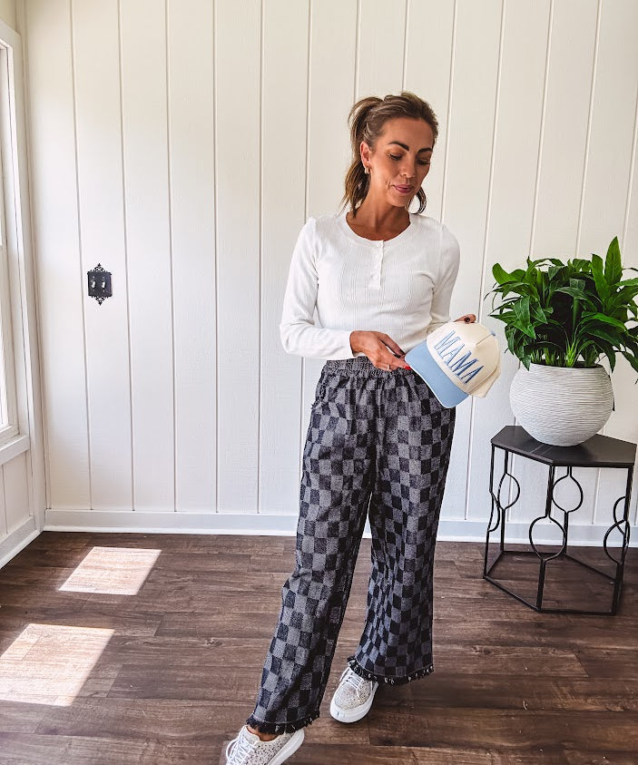 Textured washed black checkered elastic waist fray hem pants with pockets.