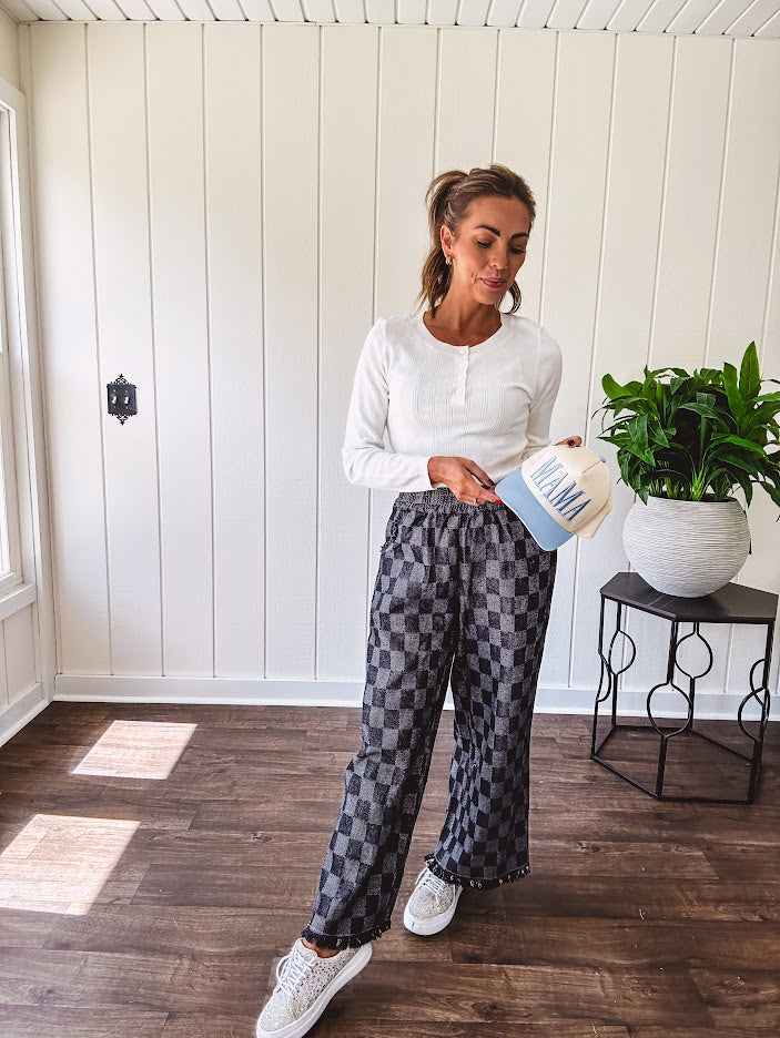 Textured washed black checkered elastic waist fray hem pants with pockets.