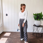 Textured washed black checkered elastic waist fray hem pants with pockets.