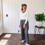 Textured washed black checkered elastic waist fray hem pants with pockets.