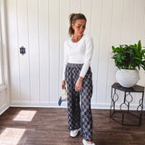 Textured washed black checkered elastic waist fray hem pants with pockets.