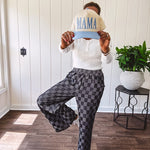 Textured washed black checkered elastic waist fray hem pants with pockets.