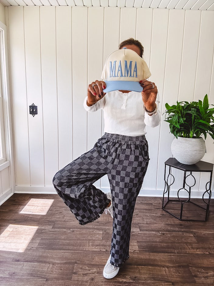 Textured washed black checkered elastic waist fray hem pants with pockets.