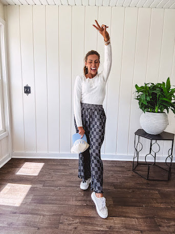 Textured washed black checkered elastic waist fray hem pants with pockets.