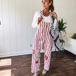 Cream and crimson striped overalls with button adjustable straps and sides with paint splatter and patchwork detail throughout.