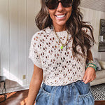 Lightweight, oatmeal open weave crochet sweater with short sleeves.