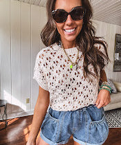 Lightweight, oatmeal open weave crochet sweater with short sleeves.