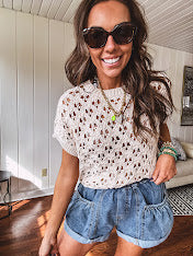 Lightweight, oatmeal open weave crochet sweater with short sleeves.