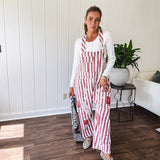 Cream and crimson striped overalls with button adjustable straps and sides with paint splatter and patchwork detail throughout.