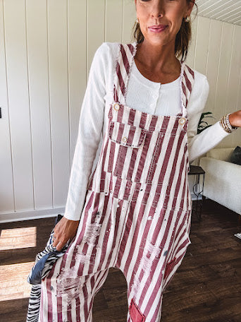 Cozy soft long sleeved ivory fine knit ribbed sweater with four abalone buttons down front.