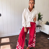 Red cotton wide leg pants with white bandana-style inserts on the outer legs.