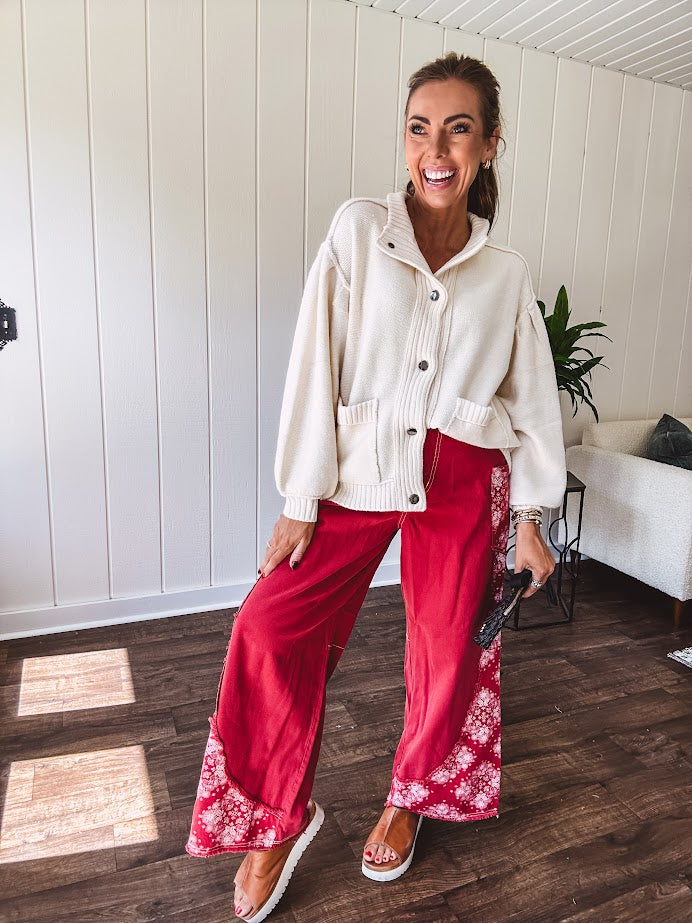 Red cotton wide leg pants with white bandana-style inserts on the outer legs.