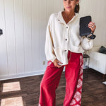 Red cotton wide leg pants with white bandana-style inserts on the outer legs.