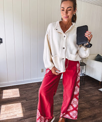 Red cotton wide leg pants with white bandana-style inserts on the outer legs.