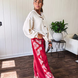 Red cotton wide leg pants with white bandana-style inserts on the outer legs.