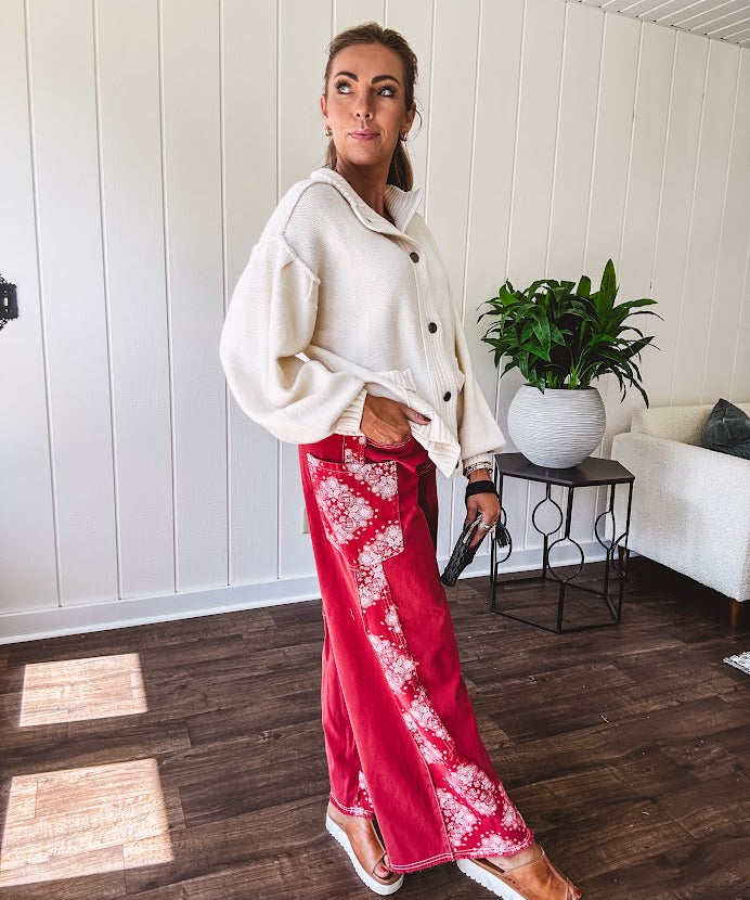 Red cotton wide leg pants with white bandana-style inserts on the outer legs.