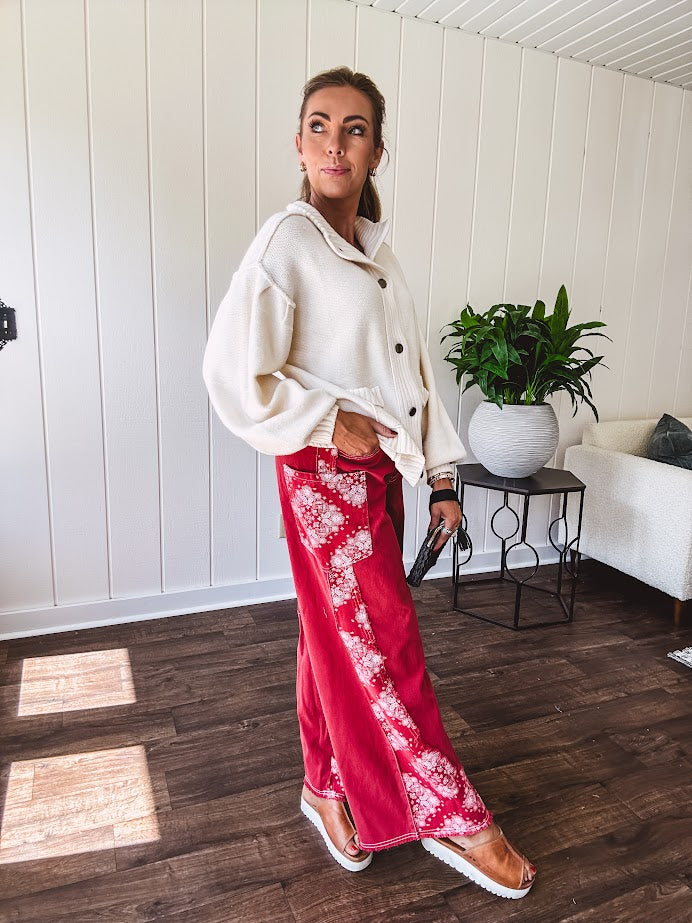 Red cotton wide leg pants with white bandana-style inserts on the outer legs.