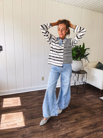 Black and ivory striped asymmetrical hem long sleeved pullover with denim collar and 3 button front.