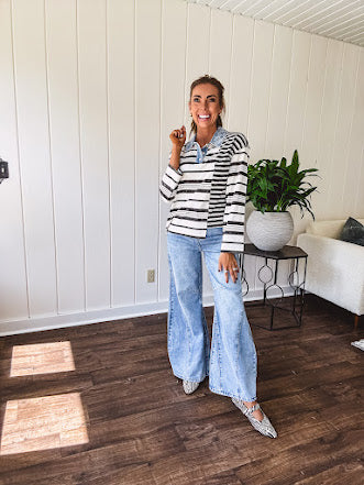 Black and ivory striped asymmetrical hem long sleeved pullover with denim collar and 3 button front.