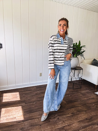 Black and ivory striped asymmetrical hem long sleeved pullover with denim collar and 3 button front.