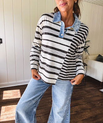 Black and ivory striped asymmetrical hem long sleeved pullover with denim collar and 3 button front.