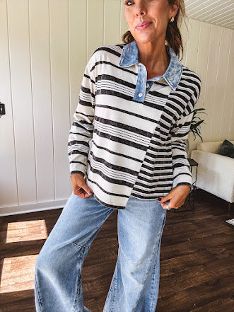 Black and ivory striped asymmetrical hem long sleeved pullover with denim collar and 3 button front.