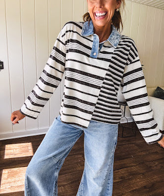 Black and ivory striped asymmetrical hem long sleeved pullover with denim collar and 3 button front.