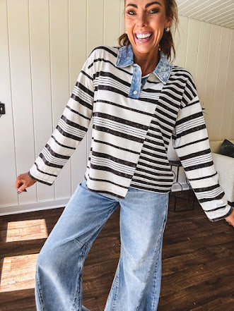 Black and ivory striped asymmetrical hem long sleeved pullover with denim collar and 3 button front.