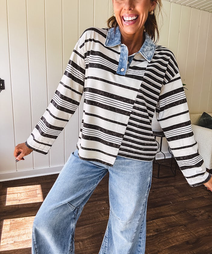 Black and ivory striped asymmetrical hem long sleeved pullover with denim collar and 3 button front.