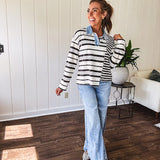 Black and ivory striped asymmetrical hem long sleeved pullover with denim collar and 3 button front.