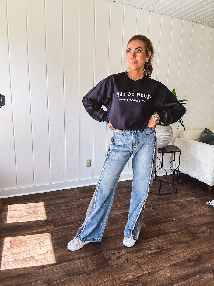 Soft black crewneck sweatshirt with "I May Be Wrong But I Doubt It" graphic on the front.