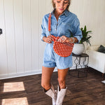 Quilted belt bag featuring zippered pockets and a gingham pattern available in several colors.