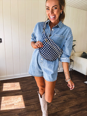Quilted belt bag featuring zippered pockets and a gingham pattern available in several colors.