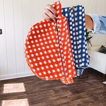 Quilted belt bag featuring zippered pockets and a gingham pattern available in several colors.