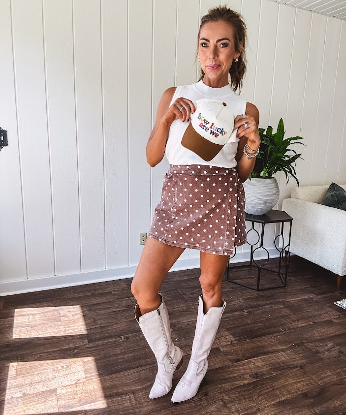 Washed light brown wrap skort with cream polka dots throughout elastic back with back pockets and side 