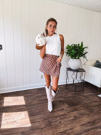 Washed light brown wrap skort with cream polka dots throughout elastic back with back pockets and side pockets.