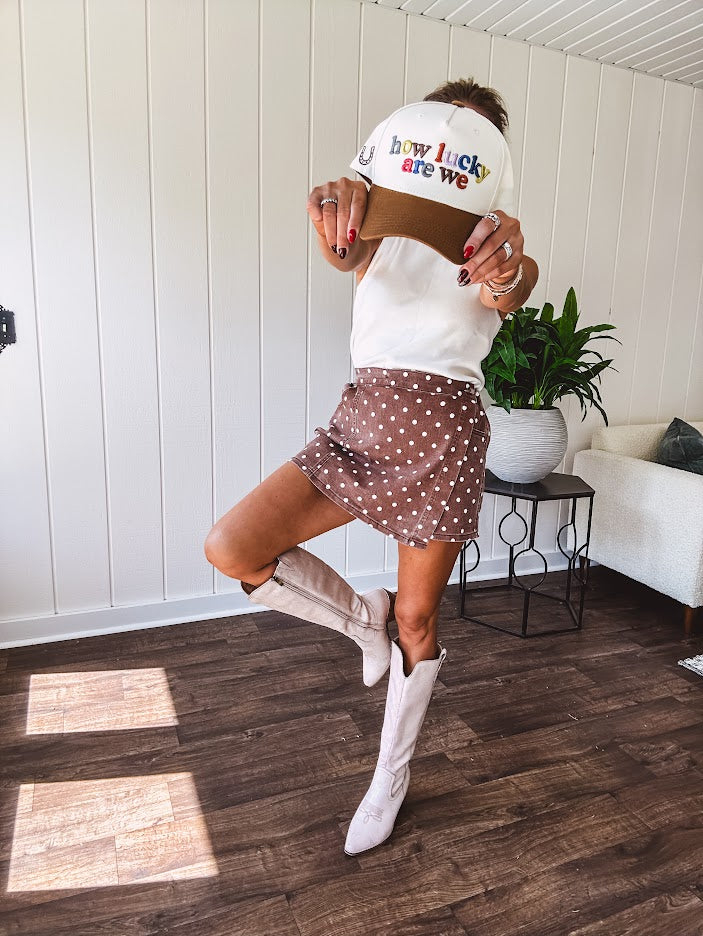 Washed light brown wrap skort with cream polka dots throughout elastic back with back pockets and side 