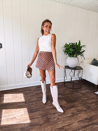 Washed light brown wrap skort with cream polka dots throughout elastic back with back pockets and side pockets.
